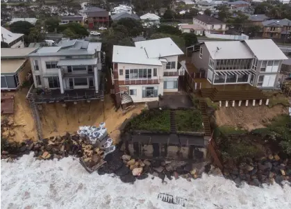  ?? Photograph: James Gourley/AAP ?? Houses undermined by erosion on Terrigal Beach, NSW, in 2020. The 2022 State of the Climate report warns extreme weather is worsening and sea level rise is accelerati­ng.