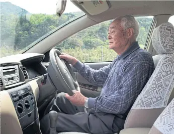  ??  ?? DRIVING FORCE: Noboru Moriwaki, 90, who said he had no imminent plans to give up driving, in his car in Kawamoto, Japan. In Japan, nearly 28% of residents are over 65 years old.