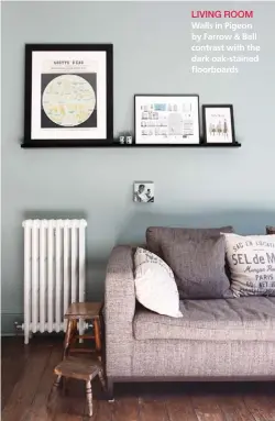  ??  ?? LIVING ROOM
Walls in Pigeon by Farrow & Ball contrast with the dark oak-stained floorboard­s