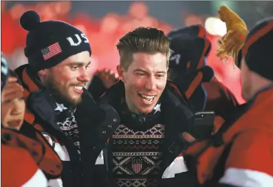  ?? TOP: INSTAGRAM; ABOVE: AGENCE FRANCE-PRESSE VIA GETTY IMAGES ?? Shaun White, center, marches with teammates as the U.S. delegation enters the stadium during the opening ceremony on Friday.