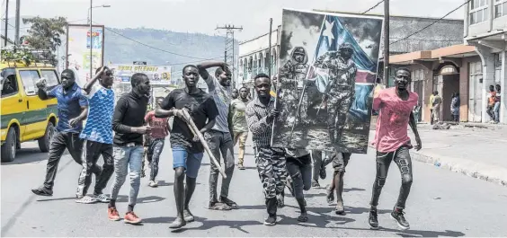  ?? Photo / AP ?? Protesters in Goma, Congo, walk towards the border with Rwanda.