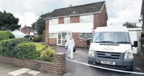  ??  ?? ● Police forensics officers at the scene in Kenilworth Road, Ainsdale