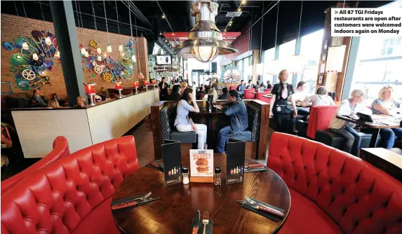  ??  ?? > All 87 TGI Fridays restaurant­s are open after customers were welcomed indoors again on Monday
