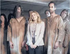  ?? CBS ?? Rose McIver, center, in the comedy series “Ghosts.”
