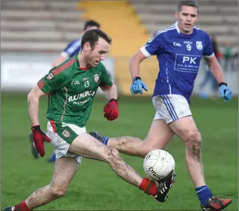  ??  ?? Ian Cusack of Glen Emmets is tracked by Meath Hill’s Keith Ginnity.