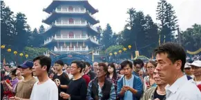  ?? — Reuters ?? important tradition: Many people observe the Qingming Festival in Taiwan, increasing the potential for large crowds at a time when social distancing is being encouraged.