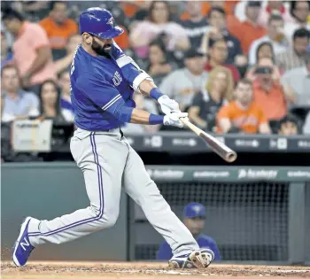  ?? ERIC CHRISTIAN SMITH/THE ASSOCIATED PRESS ?? Toronto Blue Jays’ Jose Bautista hits a solo home run, the 300th home run of his career, off Houston Astros starting pitcher Lance McCullers in the third inning of a baseball game, in Houston last season.