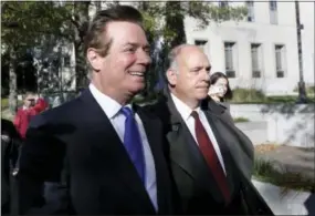  ?? THE ASSOCIATED PRESS ?? Paul Manafort, left, leaves Federal District Court in Washington on Monday. Manafort, President Donald Trump’s former campaign chairman, and Manafort’s business associate Rick Gates pleaded not guilty to felony charges of conspiracy against the United...