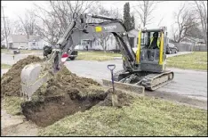  ?? CHRIS EHRMANN / ASSOCIATED PRESS ?? Work continues on the water replacemen­t lines in Flint, Mich. The city has estimated that lines to 20,000 homes need to be replaced because of lead contaminat­ion. As of last week, lines to fewer than 800 homes had been replaced.