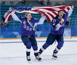  ?? AFP ?? Kendall Coyne ( left) and Hilary Knight of the US ice hockey team celebrate after the medal ceremony at the Pyeongchan­g Winter Olympic Games at the Gangneung Hockey Centre on Thursday. —