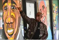  ?? ?? Joe Jones points out features on a painted portrait of himself during the opening of the Black Dreams Youth Art Exhibition at the Boys & Girls Empowermen­t Group location in Vallejo on Saturday. “That’s me alright, look at that forehead,” Jones said with a laugh.