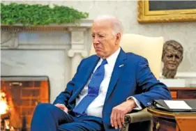 ?? AP PHOTO/ANDREW HARNIK ?? President Joe Biden sits Friday in the Oval Office of the White House in Washington.