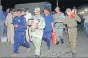  ?? PTI FILE ?? Army personnel carry extinguish­ers to douse the fire at the OFK factory in Jabalpur on Saturday.