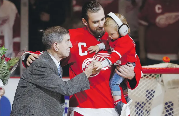  ?? — GETTY IMAGES ?? Henrik Zetterberg, who was honoured before his 1,000th game as a member of the Detroit Red Wings, introduces son Love to Wings legend Ted Lindsay on Sunday.