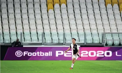  ??  ?? Paulo Dybala celebrates scoring for Juventus against Inter in a game played behind closed doors on 8 March. Photograph: Massimo Pinca/ Reuters