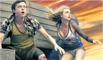  ?? VIKRAM GOUNASSEGA­RIN/STX ENTERTAINM­ENT ?? Dane DeHaan and Cara Delevingne in the sci-fi extravagan­za Valerian and the City of a Thousand Planets.