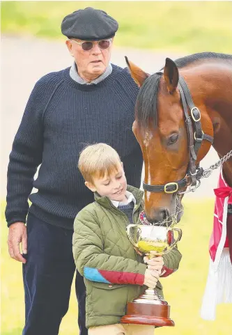  ?? Picture: GETTY IMAGES ?? Owner Lloyd Williams with grandson Frank Williams and Melbourne Cup winner Rekindling at Werribee yesterday.