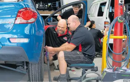  ?? Photo / NZME ?? Tony Gordon Panel Beaters & Autopainte­rs owner Kevin Hurley, left, introduced a four-day work week at his business in 2018.