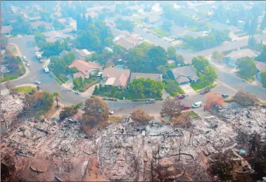  ?? MICHAEL BURKE/AP PHOTO ?? Homes destroyed by a wildfire are seen from an aerial view in the Keswick neighborho­od of Redding, Calif., Friday. Fire crews have made progress against the biggest blaze in California history but officials say the fire won’t be fully contained until September.