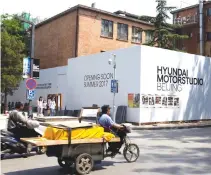  ?? REUTERS ?? A TRICYCLE drives past the constructi­on site of the Hyundai Motor Studio in Beijing, China, May 27.