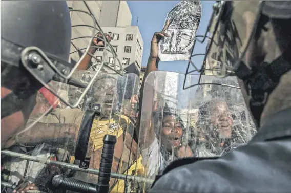  ?? Photo: Paul Botes ?? Wrong side of history: Supporters of former president Jacob Zuma outside court on the day the judgment was handed down in his rape trial. The subjective test for consent means rape myths can be raised as a defence as, arguably, occurred in the Zuma case.