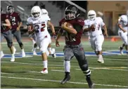  ?? RECORDER PHOTO BY CHIEKO HARA ?? Granite Hills High School's Jasper Berumen runs with the ball to score the team's first touchdown Thursday during the first half against Mcfarland at Jacob Rankin Stadium in Portervill­e.