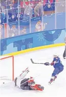  ?? MATT SLOCUM/ASSOCIATED PRESS ?? Jocelyne Lamoureux-Davidson of the United States, right, scores the winning goal during a shootout against Canada goalie Shannon Szabados in the goldmedal game Thursday.