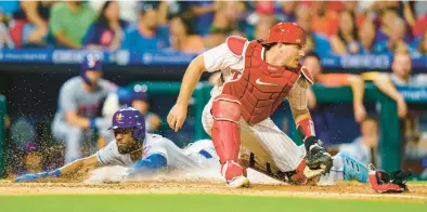  ?? CHRIS SZAGOLA/AP ?? Starling Marte slides in safely after stealing home during the Phillies against the New York Mets on Friday night.