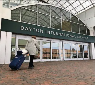  ?? KARA DRISCOLL/STAFF ?? A traveler enters the Dayton Internatio­nal Terminal.