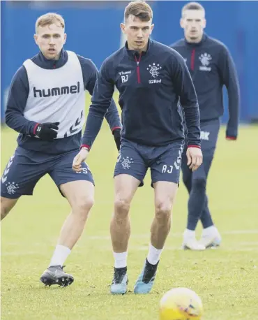  ??  ?? 0 Rangers midfielder Ryan Jack, centre, trains ahead of today’s game against Kilmarnock at Ibrox.