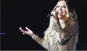  ?? Photos and text from wire services Kamran Jebreili / Associated Press ?? Mariah Carey has pulled from her rich vault to compile a new album called “The Rarities.”