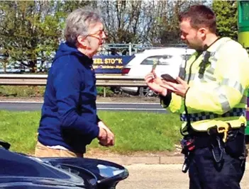  ?? ?? Talking to: Eric Clapton is spotted speaking with a police officer in 2016