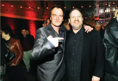  ?? (Mario Anzuoni/Reuters) ?? DIRECTOR QUENTIN TARANTINO points at producer Harvey Weinstein at the after-party for the premiere of ‘Grindhouse’ in Los Angeles in 2007.