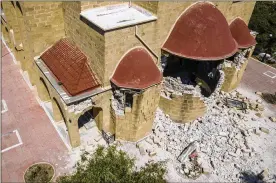  ?? NIKIFOROS PITTARAS / ASSOCIATED PRESS ?? A Greek Orthodox church on the Greek island of Kos sits damaged Friday after a powerful early morning earthquake. The quake also struck the nearby Turkish resort town of Budrum, injuring hundreds.