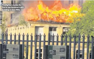  ??  ?? Firefighte­rs tackle the fire at the Herdman’s Mill building in Sion Mills