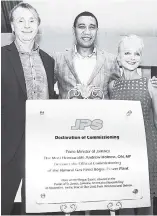  ??  ?? In this November 2016 photo, co-chairman of Fortress Wes Edens (left) poses with Prime Minister of Jamaica Andrew Holness and President & CEO of the Jamaica Public Service Company (JPSCo) Kelly Tomblin at the official commission­ing of the JPS LNG plant...