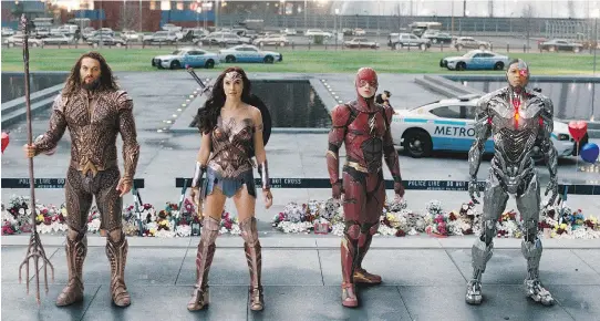  ?? PHOTOS: WARNER BROS. ?? Jason Momoa, left, as Aquaman, Gal Gadot as Wonder Woman, Ezra Miller as The Flash and Ray Fisher as Cyborg prepare for a Justice League battle.