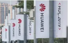  ?? AFP ?? US firms were banned from doing business with Huawei