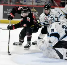  ??  ?? Warriors forward Keegan Taphorn attempts to tip the puck past Kootenay goaltender Duncan McGovern.