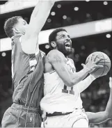  ?? ASSOCIATED PRESS FILE PHOTO ?? Kyrie Irving, right, is one of the points guards to cash in on the NBA free-agent splurge. He signed with the Brooklyn Nets for four years and US$141 million.