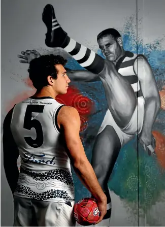  ?? GETTY IMAGES ?? Nakia Cockatoo of the Geelong Cats poses in front of a mural of club great ‘‘Polly’’ Farmer at Galleria in Melbourne last year.