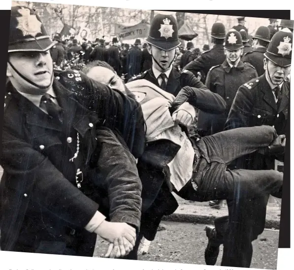  ??  ?? Clashes: Police manhandle a demonstrat­or away from scenes of mob violence in Grosvenor Square in 1968