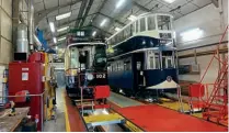  ?? MIKE CRABTREE ?? London County Council No. 1 alongside Newcastle No. 102 in the Crich Tramway Village workshops.