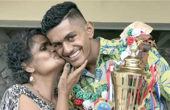  ?? Sheldon ?? 2017 Assemblies of God High School dux Vishal Prasad with his proud mother, Rina Devi, after the school’s prize-giving ceremony on November 17, 2017. Photo: