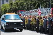  ?? JAE C. HONG/AP PHOTO ?? Firefighte­rs salute as a van carrying the body of Fire Capt. Dave Rosa passes them during a procession Monday in Long Beach, Calif.