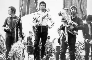  ??  ?? Left: Rod Gould, Agostini, Kim Newcombe. East German GP, Sachsenrin­g, July 9, 1972.