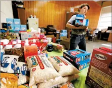  ?? ROGELIO V. SOLIS/AP ?? Church parishione­rs and area residents donate items for families affected by the Mississipp­i immigratio­n raids.