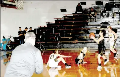  ?? MARK HUMPHREY ENTERPRISE-LEADER ?? Prairie Grove coach Kevin Froud gets excited as an effort from senior Sarah James Stone, shown tumbling onto the floor during a full-court press, results in a steal with guard Lexie Madewell in control of the basketball. Prairie Grove defeated West...