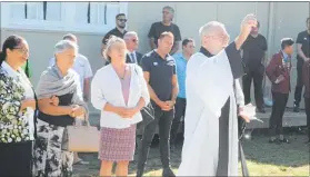  ??  ?? Rev Michael Withiel blessing the Kaitaia College buildings that now bear 367 solar panels prior to yesterday’s unveiling of a plaque marking the school’s adoption of solar energy on a grand scale.