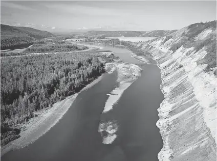  ?? GRAHAM OSBORNE ?? A section of the Peace River Valley that would be flooded by the 1,100- megawatt Site C Dam, which is expected to cost $ 7.9 billion. The proposed site is home to 32 species of fish, several of which are considered at risk, including bull trout,...